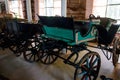 Empty vintage horse carriages parked in garage