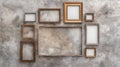 Empty vintage picture frames on a textured concrete wall, ready for artwork or photography display in a rustic, artistic setting Royalty Free Stock Photo