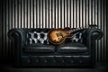 Empty vintage sofa and electric guitar with modern wood wall recording studio background. Music concept with nobody Royalty Free Stock Photo