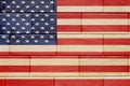 Empty vintage wooden deck table over USA flag background. USA national holidays concept. Copy space Royalty Free Stock Photo