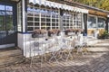 Vintage wrought iron garden table and chairs in public cafe in an autumnal garden