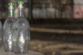 Empty vodka bottles - remnants of a drunken feast . Royalty Free Stock Photo