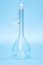 Empty volumetric flask with glass stopper Royalty Free Stock Photo