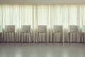 Empty voting booths arranged in a well-lit room with soft lighting, curtains casting gentle shadows, evoking the theme Royalty Free Stock Photo