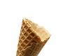 An empty waffle cone on a white background