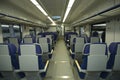Empty wagon of a commuter train, seats and doors on a background Royalty Free Stock Photo