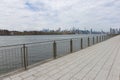 Empty Walkway along the East River at Domino Park with a View of the Manhattan Skyline in Williamsburg Brooklyn