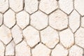 Empty wall made of rocky hexagons in beige tone