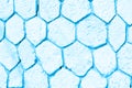 Empty wall made of rocky hexagons in blue tone