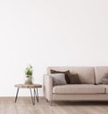 Empty wall in modern living room, beige sofa on empty white background