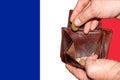 Empty wallet shows the global financial economic crisis triggered by the corona virus in France Royalty Free Stock Photo