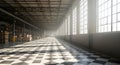Spacious warehouse interior with checkered floor and natural light streaming through windows Royalty Free Stock Photo