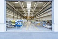 Empty warehouse interior with shelves, pallets , boxes and equipment.