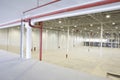 Empty Warehouse With Red Piping