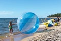 Empty zorb on the inshore waves, water activities, Zorbing extreme attraction for beach vacationers