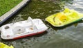 Empty water bicycles on lake