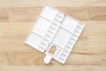 Empty watercolor palette background. White plastic paint palette. Watercolor tray on wood Royalty Free Stock Photo