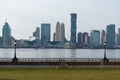 Empty Waterfront at Battery Park in New York City with a view of the Jersey City Skyline along the Hudson River Royalty Free Stock Photo