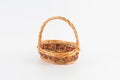 Empty weaved fruit and bread basket isolated on a white background Royalty Free Stock Photo
