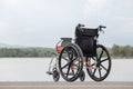 Empty wheelchair on lake Royalty Free Stock Photo