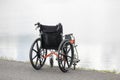 Empty wheelchair on lake Royalty Free Stock Photo