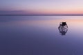 Empty wheelchair on the lake at sunset with beautiful colours Royalty Free Stock Photo