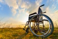 Empty wheelchair on the meadow Royalty Free Stock Photo