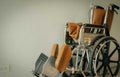 Empty wheelchair near wall in hospital for service patient and people with disability. Medical equipment in hospital for Royalty Free Stock Photo