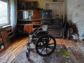 Empty wheelchair in old abandoned house Royalty Free Stock Photo