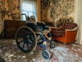 Empty wheelchair in old abandoned house Royalty Free Stock Photo