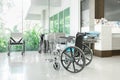 Empty wheelchair parked in hospital hallway