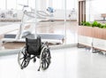 Empty wheelchair parked in hospital hallway Royalty Free Stock Photo