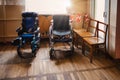 Empty wheelchair parked in hospital hallway Royalty Free Stock Photo