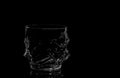 Empty whiskey tumbler glasses on black abd white background, isolated Royalty Free Stock Photo