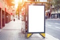 Empty white advertising urban billboard near city bus stop, placeholder template on a street, space for design layout. sunset Royalty Free Stock Photo