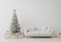 On an empty white background, a gray tufted sofa, fur pillows, lantern, and a decorated tree is mocked up on the wall. Royalty Free Stock Photo