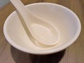 White bowl with Chinese spoon Royalty Free Stock Photo