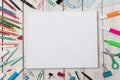 Empty white canvas frame and colorful pencils on white wooden Royalty Free Stock Photo