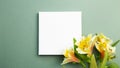 Empty white canvas with yellow flower bouquet on green background Royalty Free Stock Photo