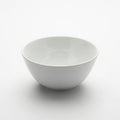 Empty white ceramic bowl, clean minimalist kitchenware studio shot Royalty Free Stock Photo