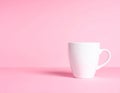 Empty White Ceramic Mug on a Pink Surface with Subtle Shadow image photo Royalty Free Stock Photo