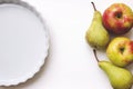 Empty white ceramics tart or pie baking dish, on white table, wi