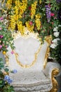 Empty white chair surrounded by multi-colored