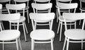 Rows of Empty White Chairs in a Conference Room Royalty Free Stock Photo