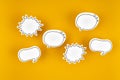 Empty white chat bubbles over yellow background