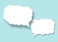 Empty white cloud paper speech bubble shape against light blue background Royalty Free Stock Photo