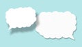 Empty white cloud paper speech bubble shape against light blue background Royalty Free Stock Photo