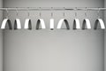 Empty white coat hangers on clothes rail. With copy space Royalty Free Stock Photo