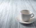 Empty white cup on blue wood rustic table pure background text Royalty Free Stock Photo