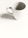 Empty white cup on a light background. Cup with place for text. Copyspace Royalty Free Stock Photo